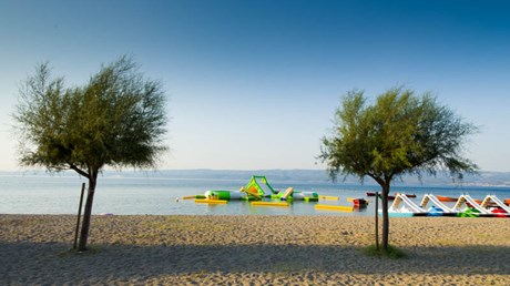 Sandy beach in Omi, perfect for vacation with small children